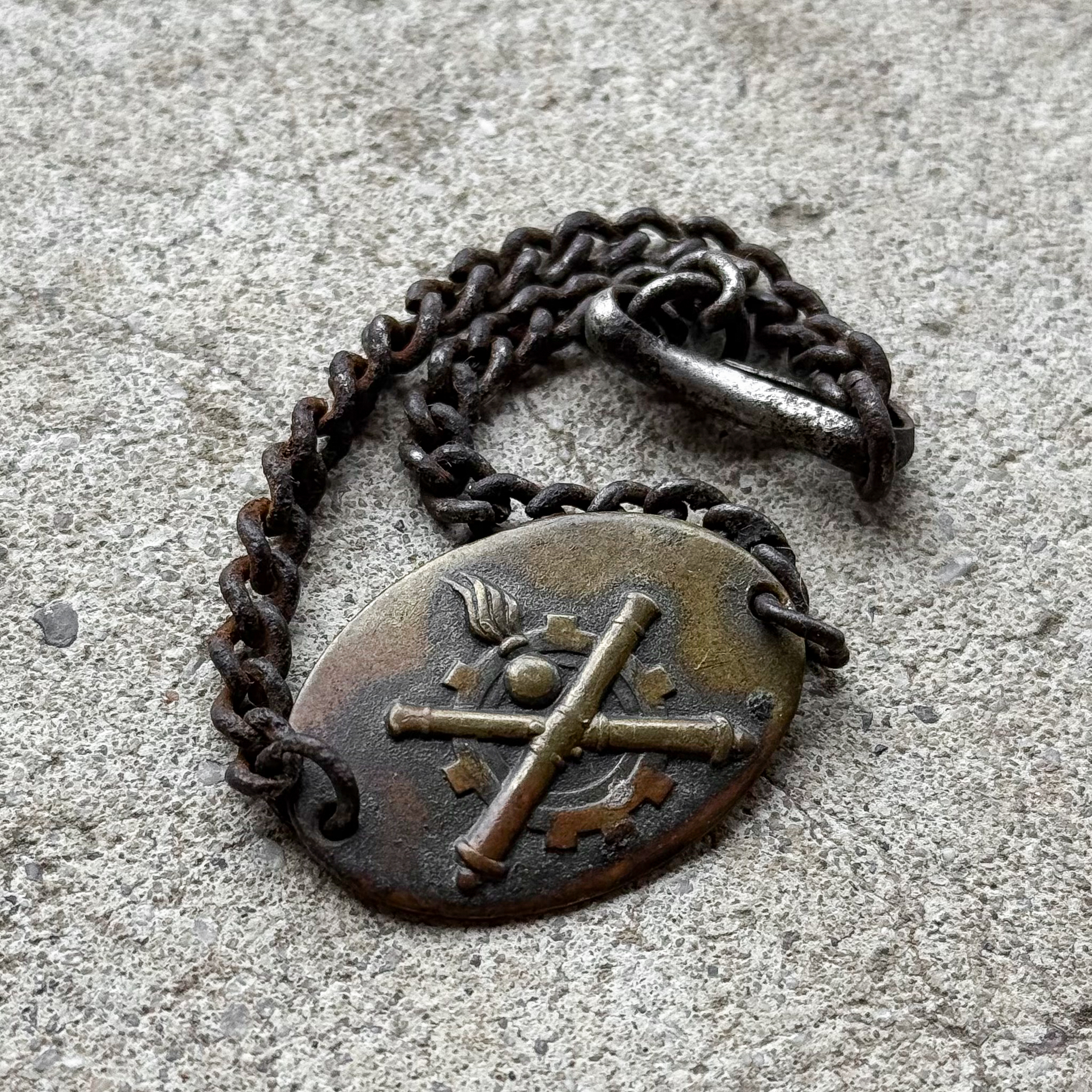 Antique WWI French brass identity bracelet with crossed cannons artillery emblem