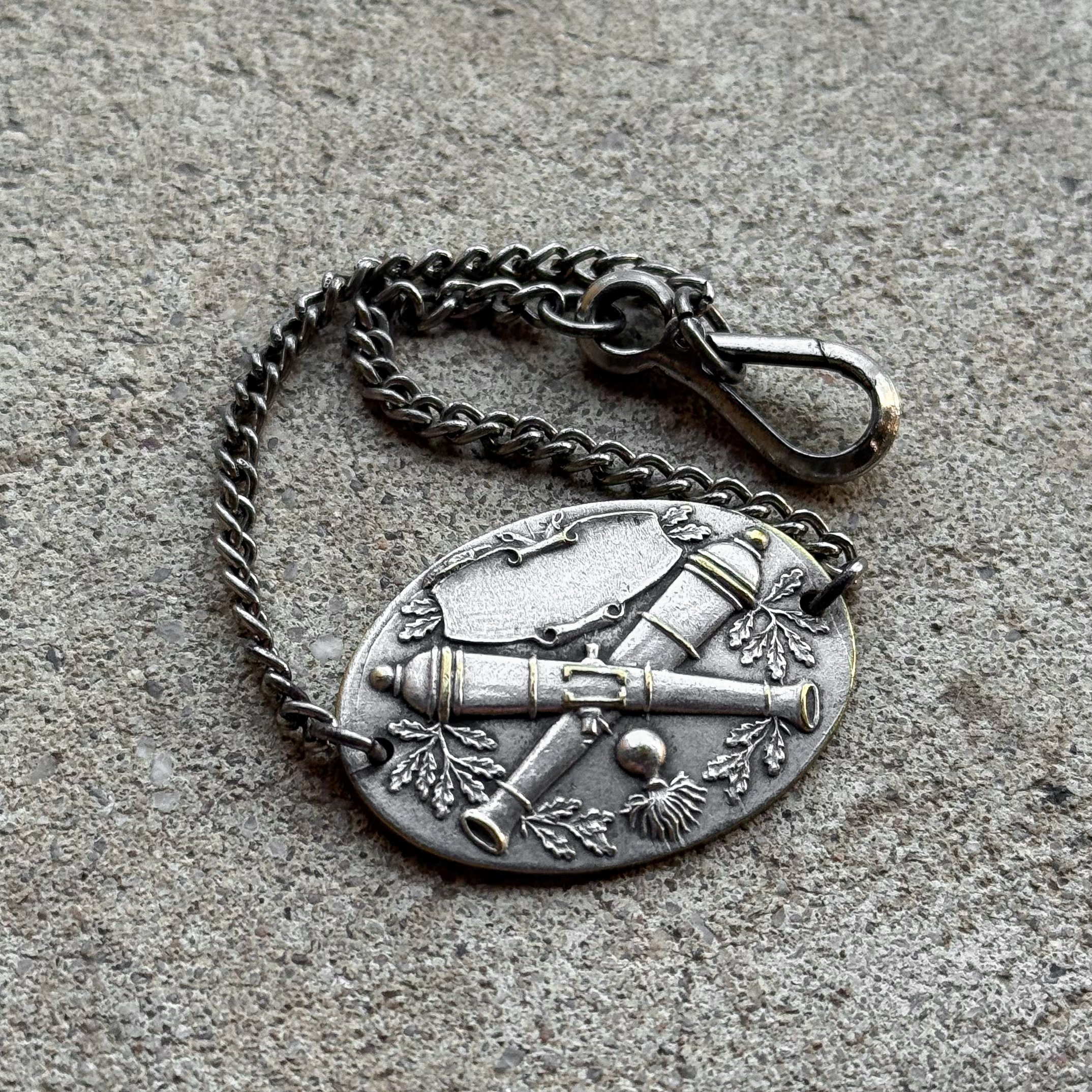 Antique WWI French military identity bracelet with crossed cannons artillery emblem