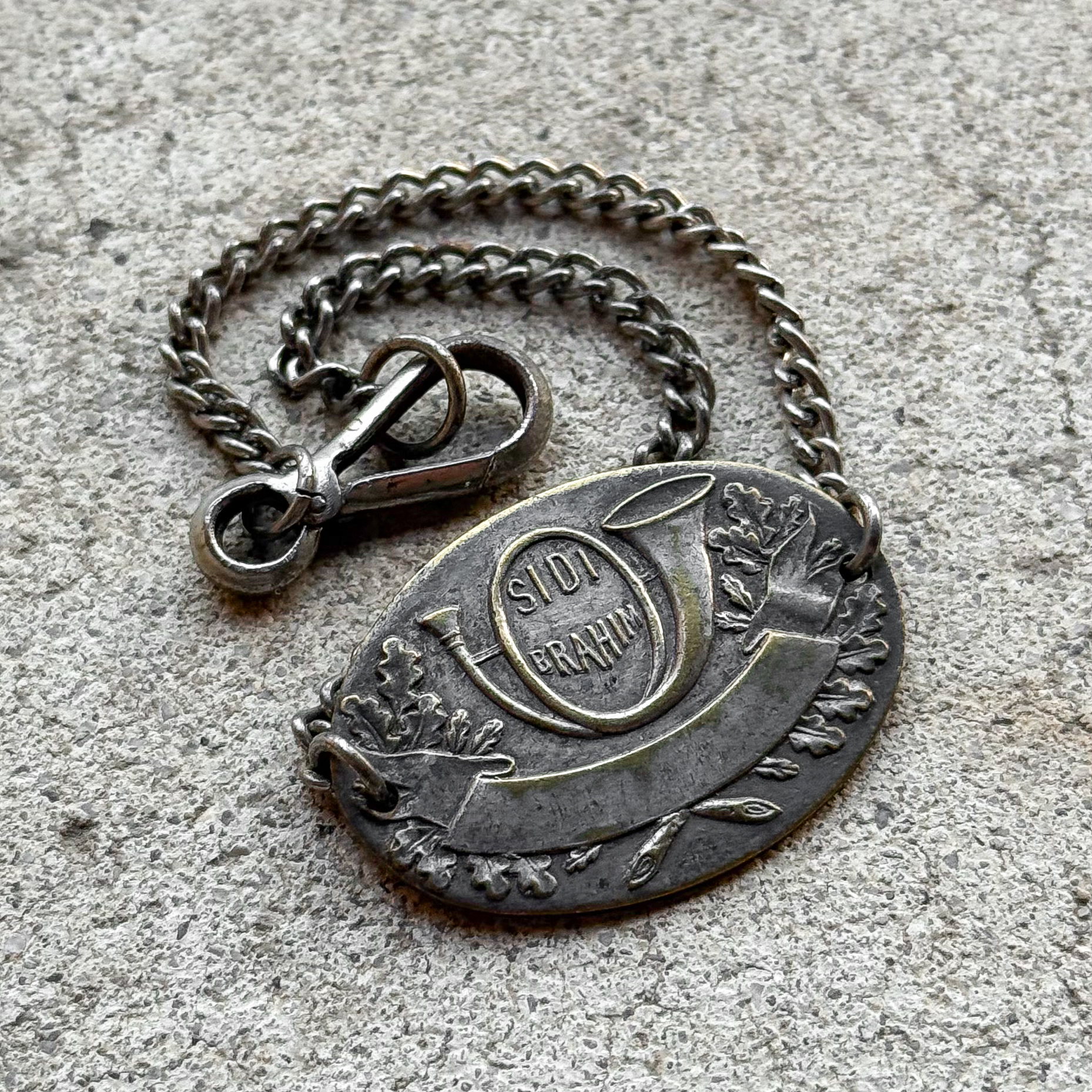Antique WWI French military identity bracelet with hunting horn emblem and Sidi-Brahim inscription