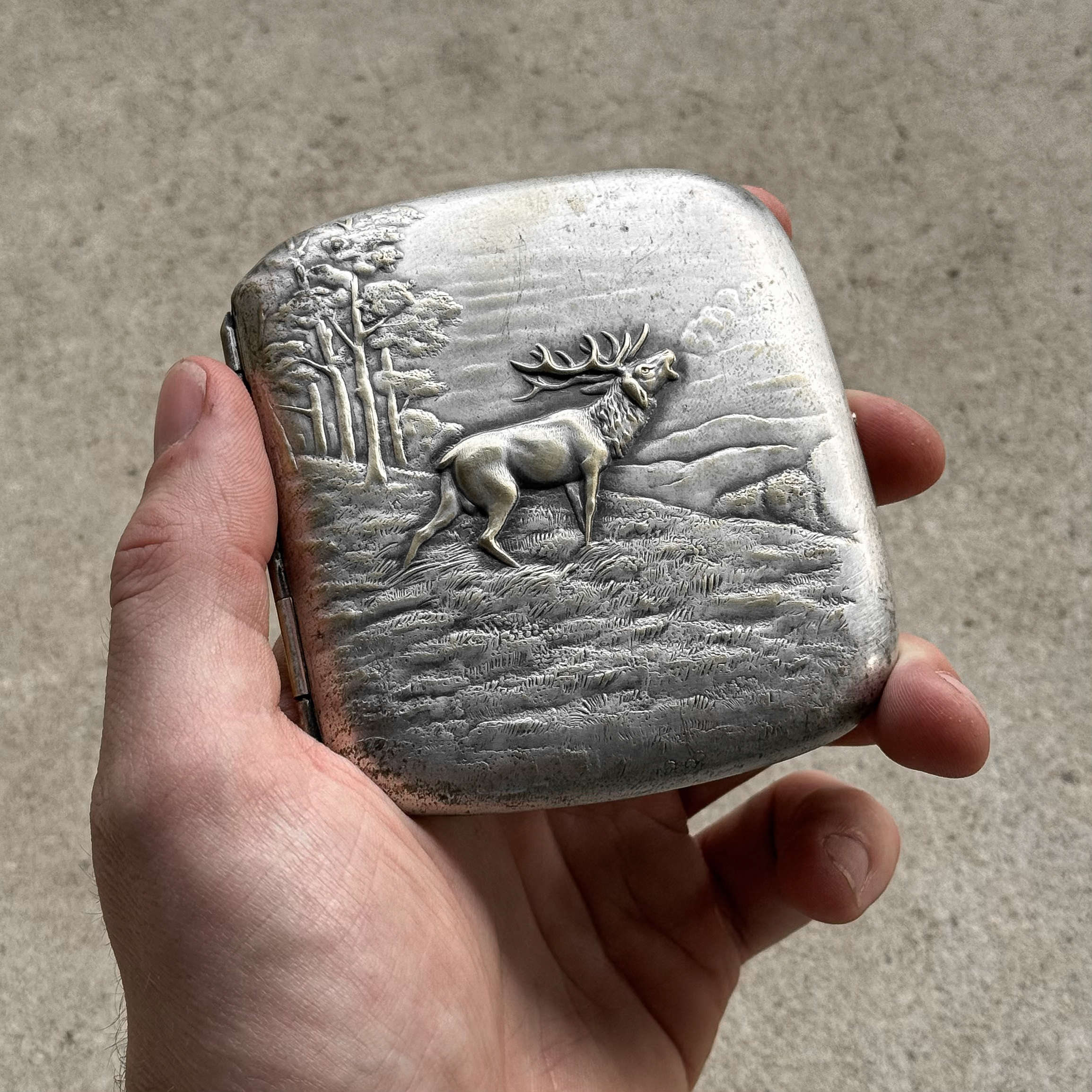 Vintage 1930s Austrian cigarette case with a red deer hunting scene on the lid