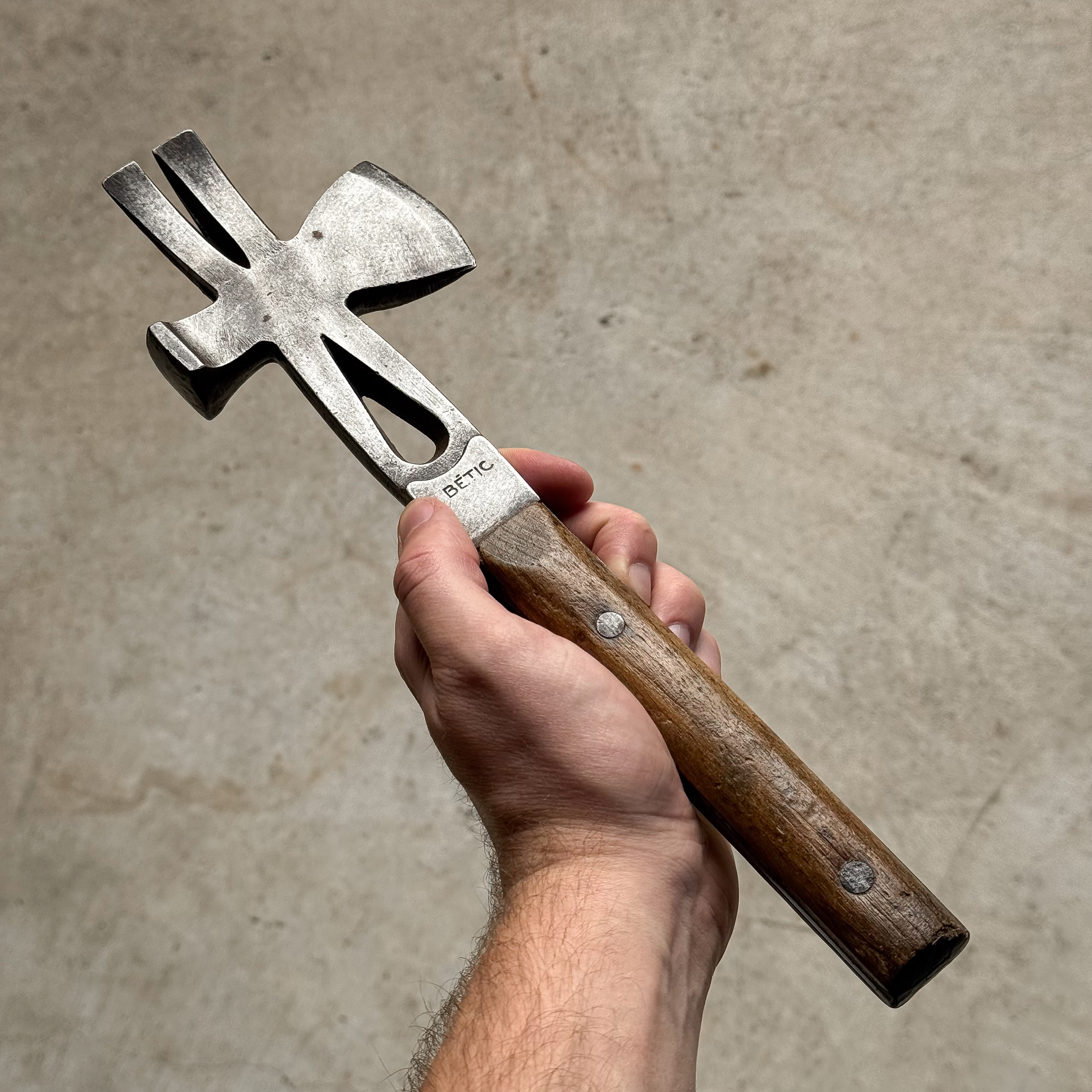 Vintage 1930s German multitool combining a hammer, hatchet and crowbar in one compact design.