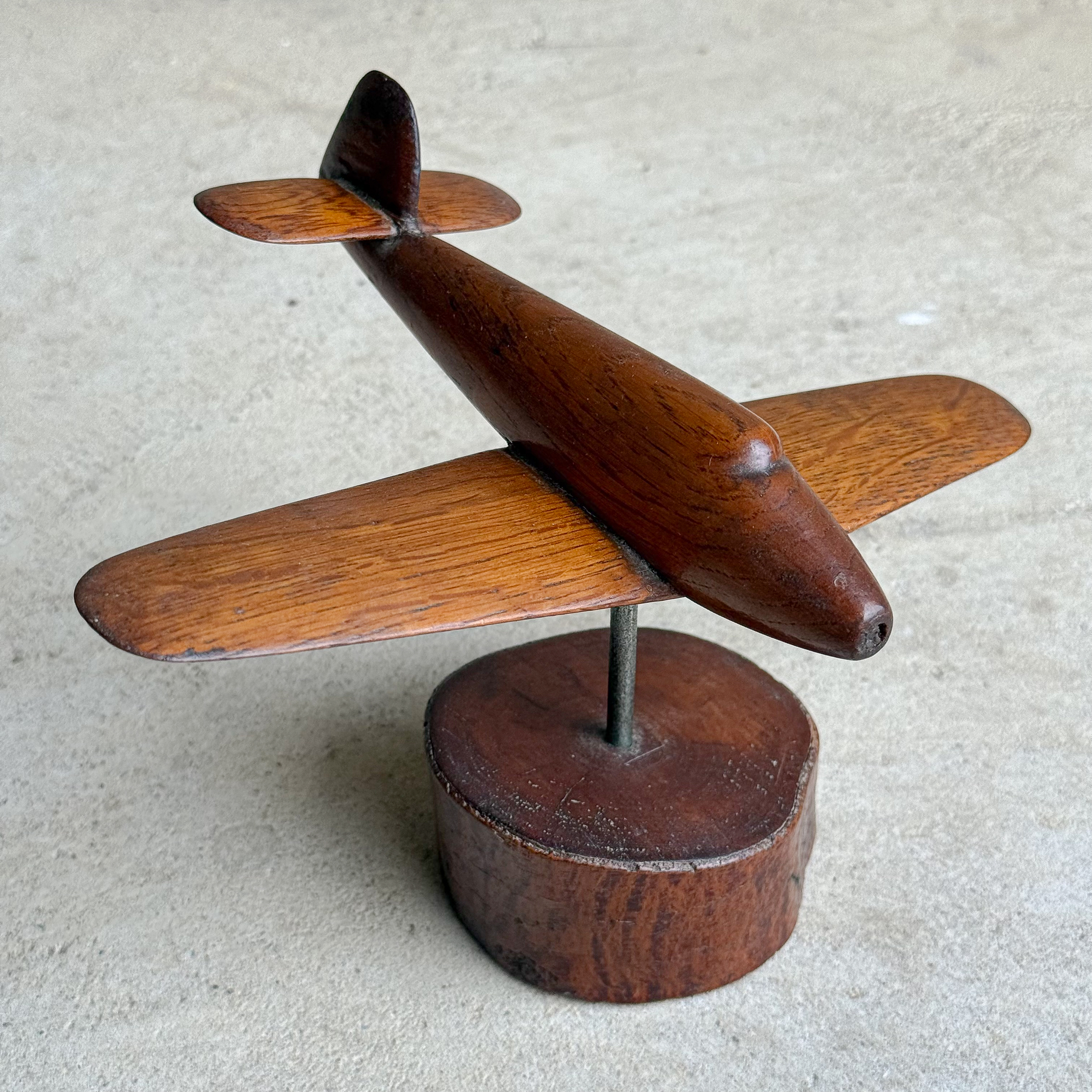 Vintage 1940 French folk art wooden Spitfire airplane model on a wooden base