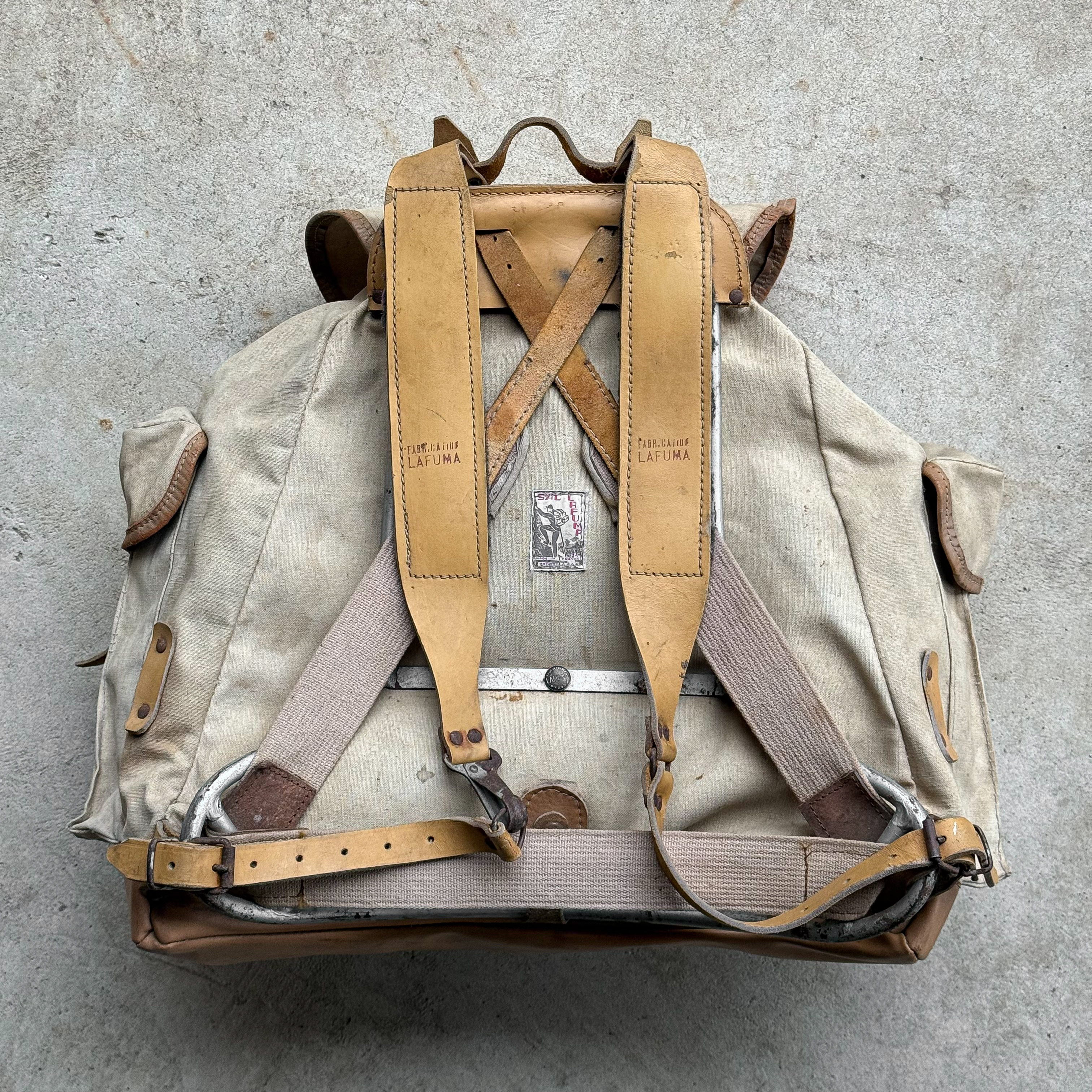 Vintage 1950s French Lafuma cream canvas rucksack with leather straps, leather bottom
