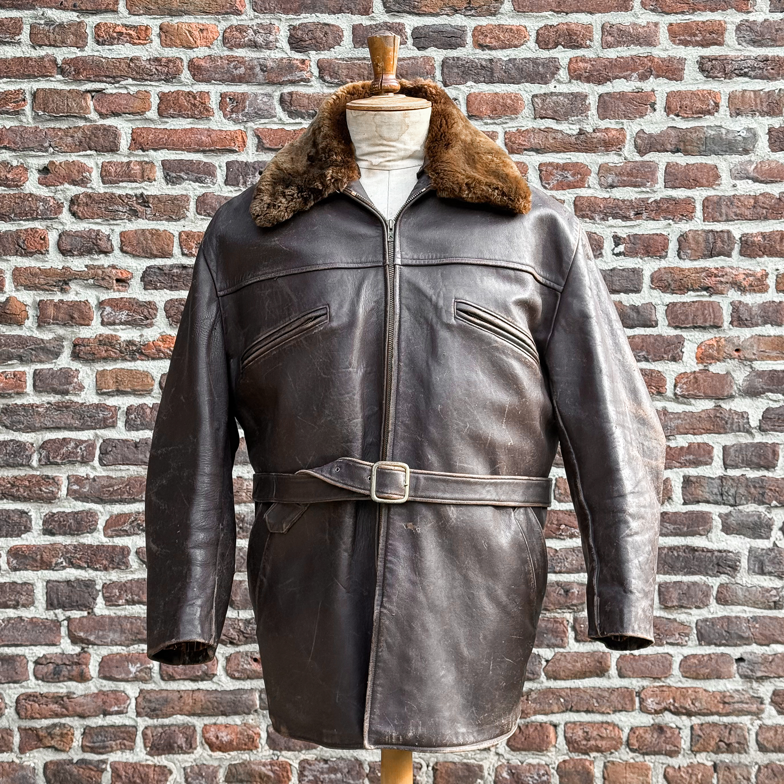 Vintage 1950s French leather coat with shearling lining, sheepskin collar, waist belt and Eclair zipper