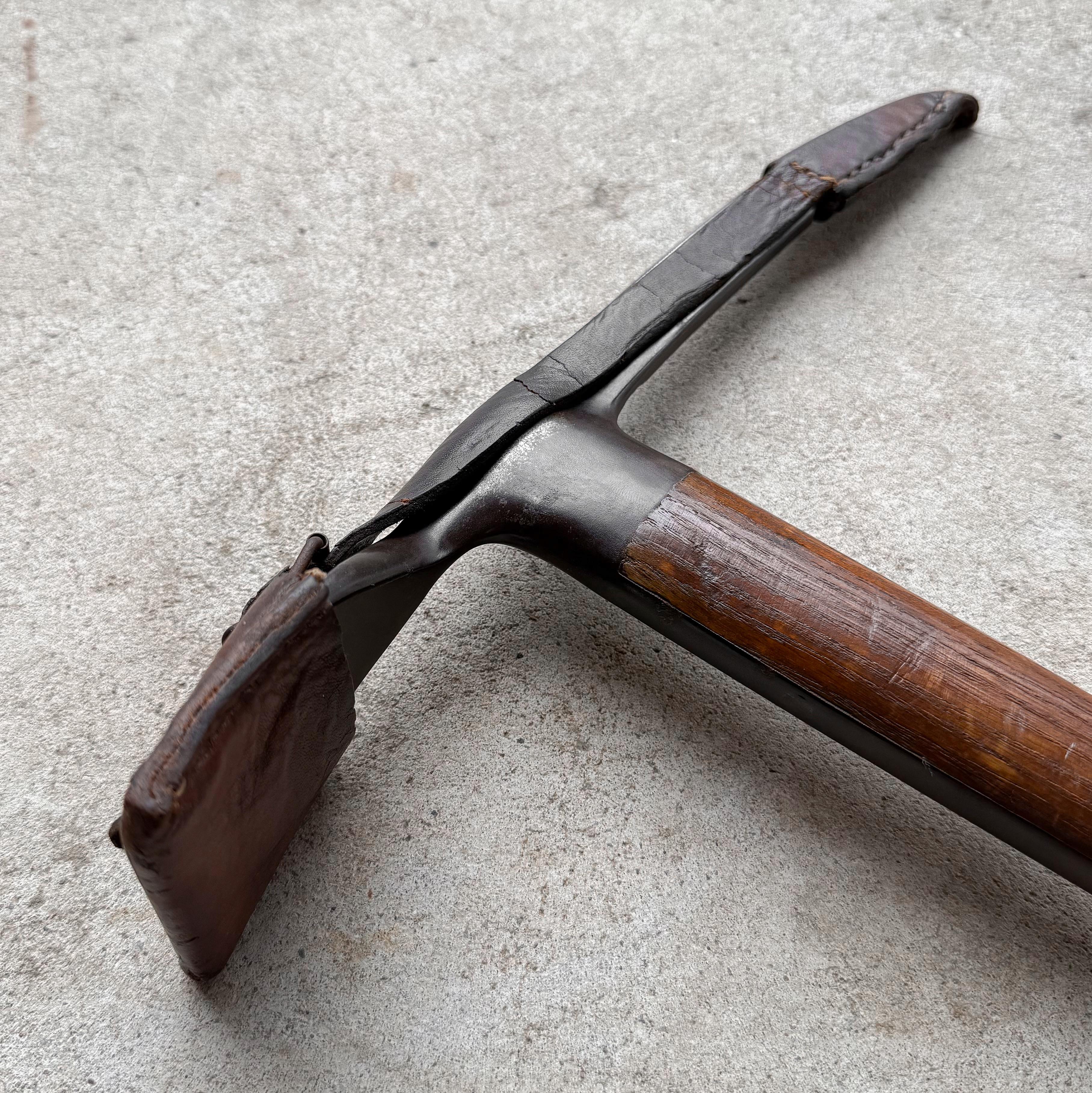 Vintage 1950s Felix Ralling ice axe from Fulpmes, Austria, with wooden shaft and original leather sheath